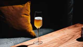 Alcohol delivery in Toronto | a rust-coloured cocktail in a flute glass at Supernova Ballroom in Toronto