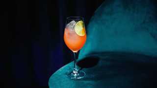 Alcohol delivery in Toronto | an orange cocktail in a wine glass at Supernova Ballroom in Toronto