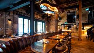 The best pizza in Toronto | A piano chandelier hangs over the tables at the Parlour on King West