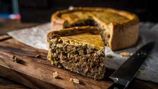 A beautiful meat pie cooked on a Traeger grill