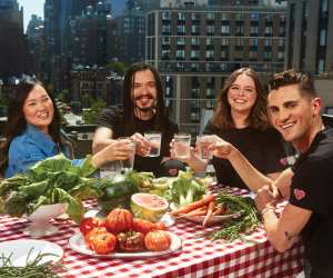 Michael Kors Watch Hunger Stop 2021 campaign | Friends enjoy a meal while wearing items from the Watch Hunger Stop capsule