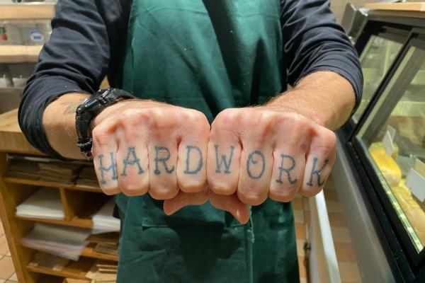 A staff tattoo at Russell's Butcher & Deli