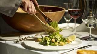 Toronto's best steakhouses | Tableside caesar salad is prepared at Hy's Steakhouse & Cocktail Bar