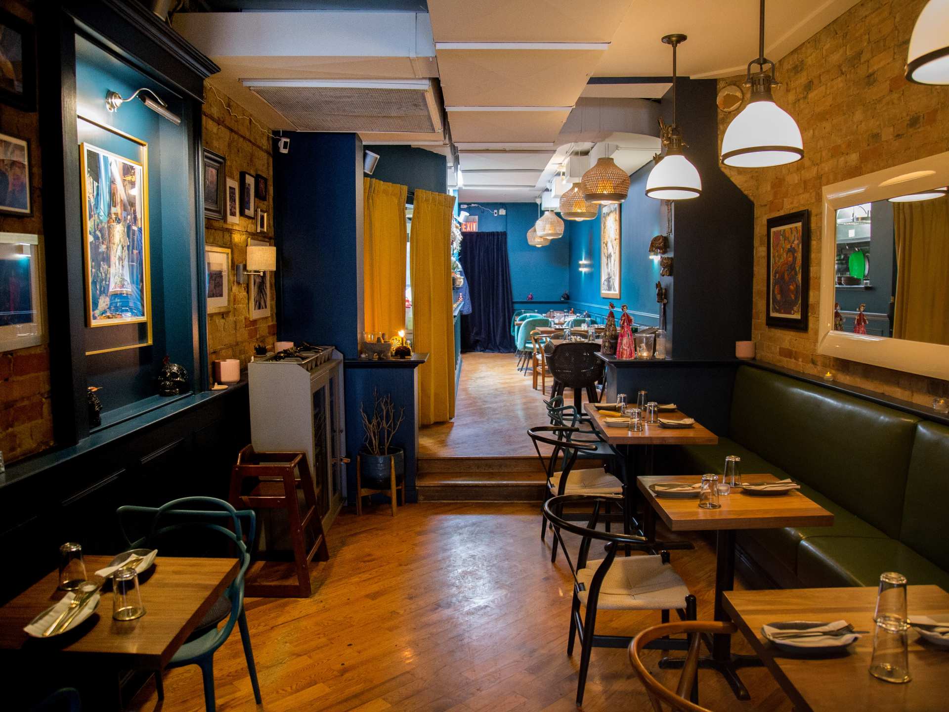 Best Michelin restaurants | Blue cactus leather booths at La Bartola restaurant on College St.