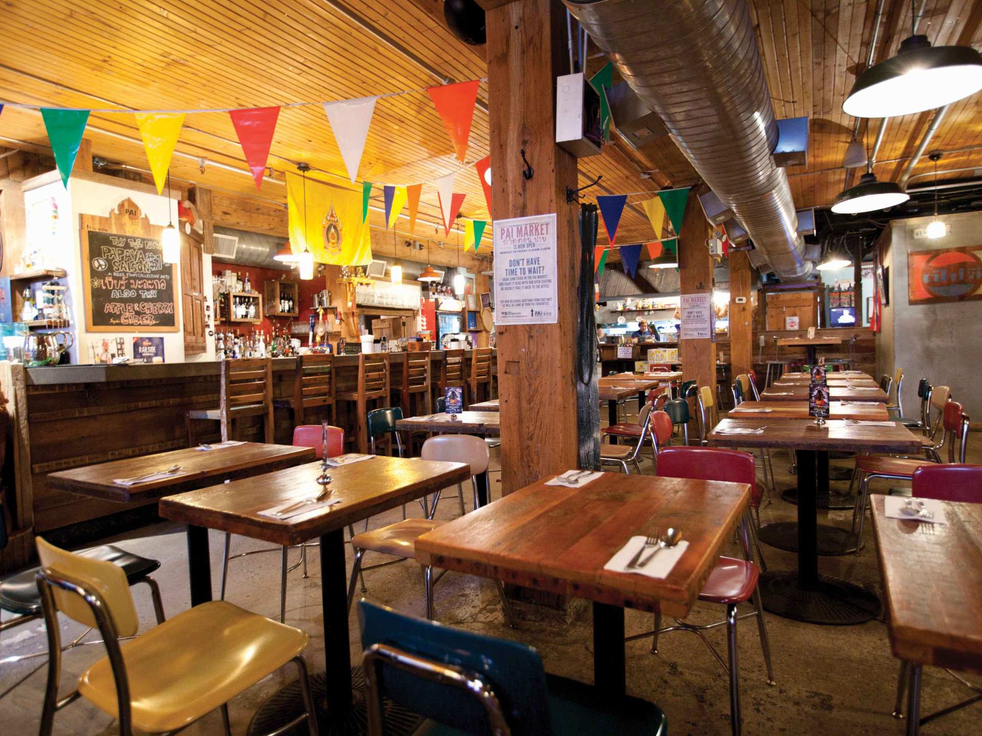 Best Michelin guide restaurants | Colourful flags strung across the ceiling at Pai restaurant in downtown Toronto