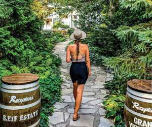 A girl walks through Reif Estate Winery in Niagara