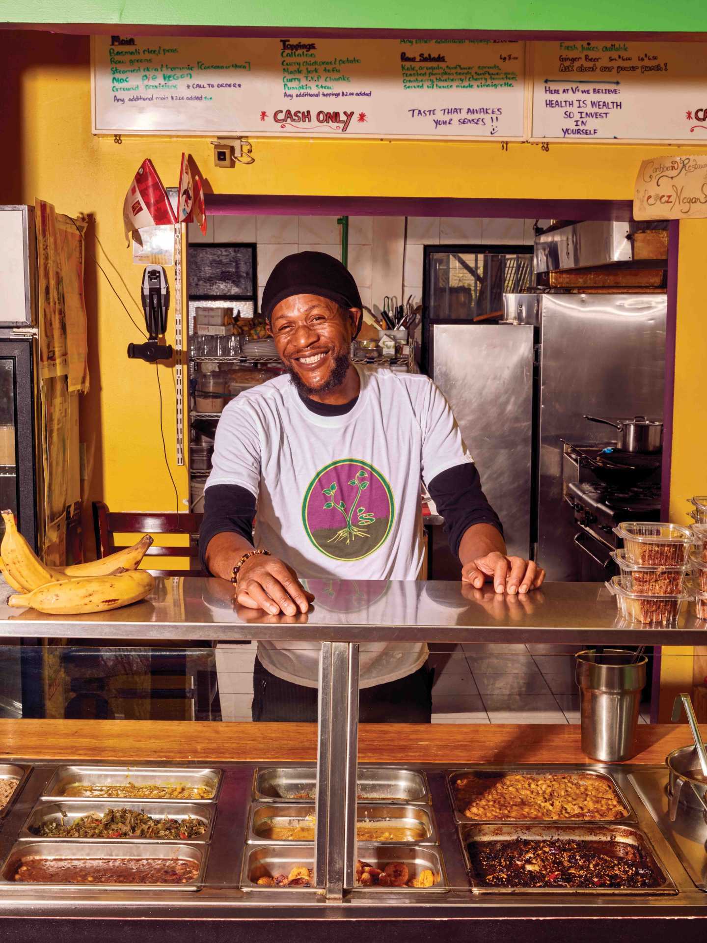 Vegan food in Toronto | Chef Pong standing behind the counter at V's Caribbean Restaurant