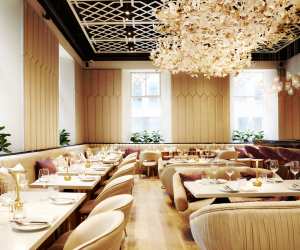 A floral chandelier hangs over the dining room at Laylak