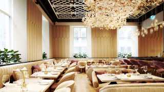 A floral chandelier hangs over the dining room at Laylak