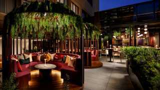 Birdcage-style booths at Skylight restaurant at the W Toronto hotel