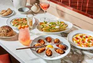 New culinary experiences in Toronto | A spread of dishes at Toronto Beach Club