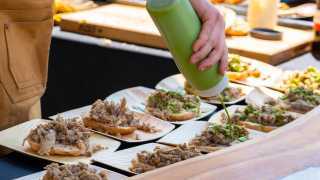 A chef preparing dishes at Feast On the Farm