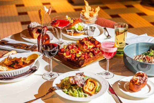 A spread of dishes and drinks at The Joneses restaurant in Toronto