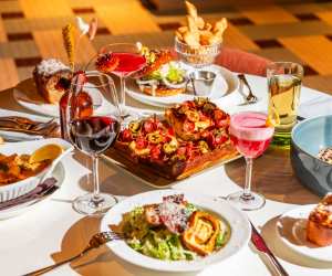 A spread of dishes and drinks at The Joneses restaurant in Toronto