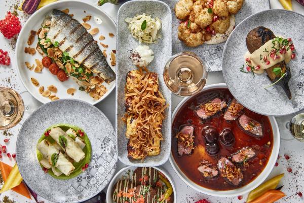 A spread of dishes at Miss Aida in Toronto