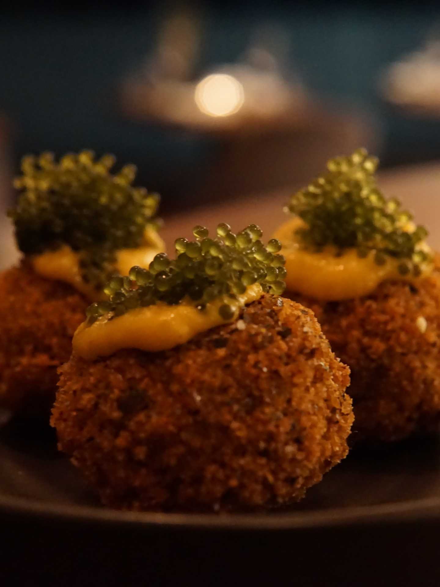 Vegan crab cakes with sea pearl caviar at Bar Avelo