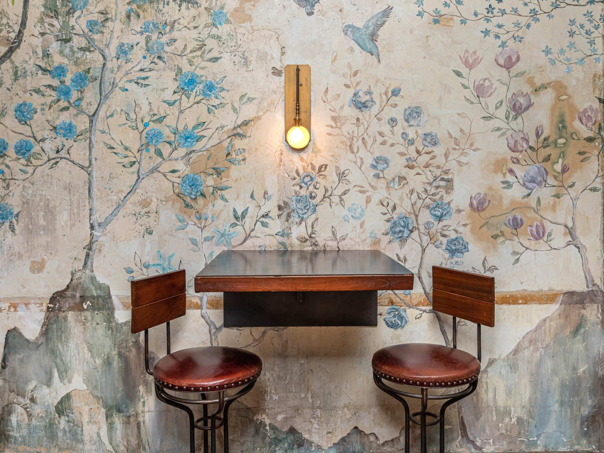Best restaurants Toronto | Seating by a watercolour mural at DaiLo