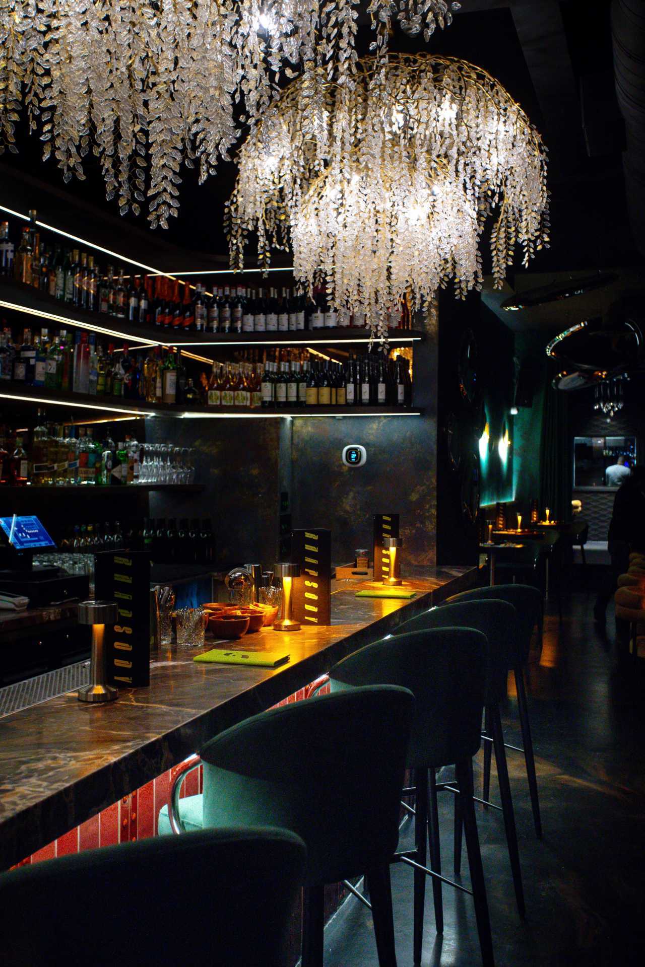 Chandeliers above the bar at Rhapsody on Ossington in Toronto