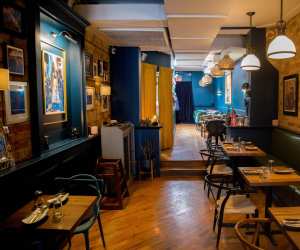 The interior of La Bartola plant-based restaurant in Little Italy, Toronto