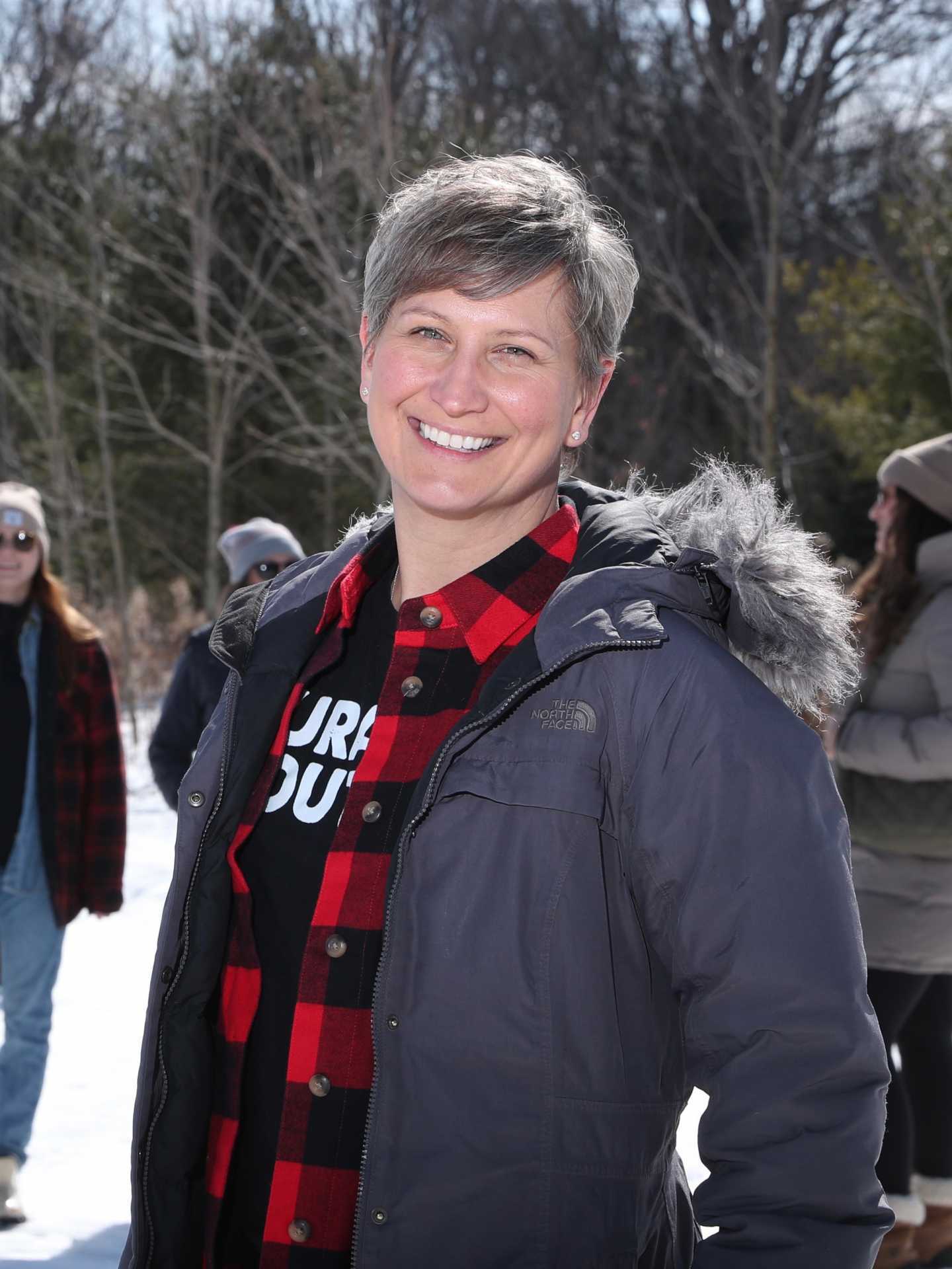 Rural Route Tour Co. maple syrup farm tour | Tamara Stefek smiling in a snowy forest