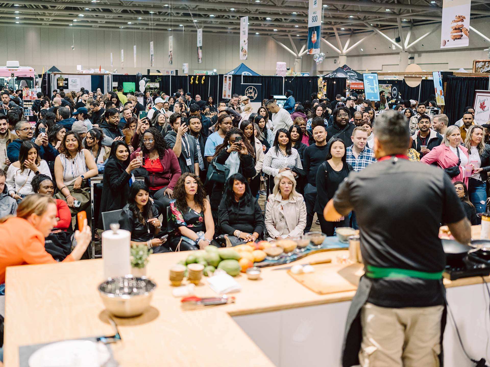 A crowd watching a cooking demonstration at T.O. Food and Drink Fest