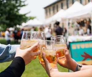 Glasses cheersing at the Spring into Spice food and wine festival Toronto